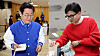 Lee Jae-myung, leader of the Democratic Party, and Han Dong-hoon, People Power Party interim chief, vote at an early voting booth on April 5, 2024. [YONHAP]