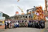The U.S. Navy’s logistics support vessel, the USNS Wally Schirra, arrived at Hanwha Ocean’s shipyard in Geoje, South Gyeongsang, on Sept. 2 for depot-level maintenance. Officials from both countries take a commemorative photo during the welcoming ceremony on Sept. 3, 2024. [YONHAP]