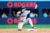 Lee Jung-hoo of the San Francisco Giants reacts on base after hitting a double, later to have the tag called overturned to be tagged out in the sixth inning of their MLB game against the Toronto Blue Jays Rogers Centre on July 20 in Toronto, Canada. [AFP/YONHAP]