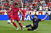 Korea's Son Heung-min, left, is tackled by United States' Maximilian Arfsten, right, during a friendly at Sports Illustrated Stadium on Sept. 6 in Harrison, New Jersey. [AP/YONHAP]