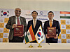 Hanwha Aerospace CEO Son Jae-il, right, and Arun Ramchandani, executive vice president of Larsen & Toubro, left, pose for a photo with Lee Seong-ho, Korea's ambassador to India, center, during a signing ceremony held at the South Korean Embassy in New Delhi on April 3. [YONHAP]