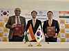 Hanwha Aerospace CEO Son Jae-il, right, and Arun Ramchandani, executive vice president of Larsen & Toubro, left, pose for a photo with Lee Seong-ho, Korea's ambassador to India, center, during a signing ceremony held at the South Korean Embassy in New Delhi on April 3. [YONHAP]