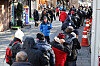 Older people wait in line to receive free meals at a soup kitchen near Tapgol Park in Jongno District, central Seoul, on Dec. 24, 2024. [YONHAP]