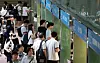Young people attend a job fair held at Jonggak Station Solar Garden in Jung District, central Seoul, on May 31. [YONHAP]