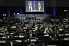 A presidential debate between Republican presidential nominee former President Donald Trump, on screen on the left, and Democratic presidential nominee Vice President Kamala Harris is seen from the spin room on Tuesday in Philadelphia. (AP Photo/Matt Rourke)