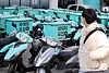 Baemin motorcycles are parked in front of a Baemin rider center in Seoul in 2022. [YONHAP]