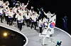 Team Korea enters the San Siro stadium in Milan at the opening ceremony of the 2026 Milan-Cortina Winter Olympics held Feb. 6, with figure skater Cha Jun-hwan and speed skater Park Ji-woo bearing the Korean national flag. [KIM JONG-HO]
