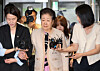Unification Church leader Han Hak-ja, center, arrives for questioning at the office of special counsel Min Joong-ki in Jongno District, central Seoul, on Sept. 17. Han, who has been accused by prosecutors of bribing former first lady Kim Keon Hee and conservative lawmaker Kweon Seong-dong, was indicted on Oct. 9 on charges of bribery, embezzlement and violating political funding laws. [YONHAP]