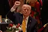 U.S. President Donald Trump pumps his fist at Christmas Eve dinner at his Mar-a-Lago club in Palm Beach, Florida, on Dec. 24. [AP/YONHAP]