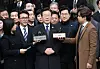 Democratic Party leader Lee Jae-myung, center, speaks outside the Seoul Central District Court in Seocho District, southern Seoul, after the court's ruling was announced on Monday afternoon. [JOINT PRESS CORPS]