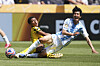 Borussia Dortmund's Jobe Bellinghamm, background, stops Ulsan HD's Kim Min-hyeok during the Club World Cup Group F match between Borussia Dortmund and Ulsan in Cincinnati, United States, June 25, 2025. [YONHAP]