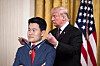 A doctored image of U.S. President Donald Trump giving an award to Jeon Han-gil [SCREEN CAPTURE]