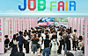 Job seekers speak with company recruiters at a job fair held at Pukyong National University in Busan on Sept. 10. [YONHAP]