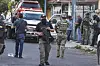 Members of the general prosecutor's office and the Navy stand guard near a vehicle involved in a shootout in Veracruz, Mexico on May 12. [AP/YONHAP]