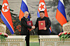 Russian President Vladimir Putin, left, and North Korea's leader Kim Jong-un pose for a photo during the signing ceremony of a comprehensive strategic partnership agreement in Pyongyang, North Korea, on June 19. [NEWS1]