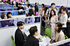 Foreign students take part in on-site job interviews during the 2025 Job Fair for International Students in Busan at Bexco in Haeundae District, Busan, on Aug. 19. [YONHAP]