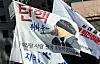 Flags featuring memes and silly names of made-up organizations used during the rally demanding the impeachment of President Yoon Suk Yeol near the National Assembly in western Seoul on Dec. 14. [YONHAP]