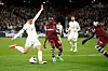 Tottenham Hotspur's Son Heung-min, left, takes a shot on goal under pressure from West Ham's Mohammed Kudus at London Stadium in London, England on Tuesday. [YONHAP]