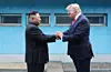 North Korean leader Kim Jong-un, left, and U.S. President Donald Trump hold hands during a summit at the Panmunjom truce village along the inter-Korean border on June 30, 2019. [YONHAP]