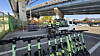 Workers unload towed electric scooters at the designated storage area for personal mobility devices inside a vehicle impound lot in Cheonan, South Chungcheong, on Nov. 11. [SHIN JIN-HO]