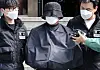 A 56-year-old YouTuber is transferred to the prosecution from Yeonje Police Precinct in Yeonje District, Busan on May 16, 2024. [YONHAP]