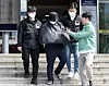 A 56-year-old YouTuber is transferred to the prosecution from the Yeonje Police Precinct in Yeonje District, Busan, on May 16, 2024. [YONHAP]