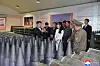 North Korea's leader Kim Jong-un, left, inspects a munitions factory the previous day to review the state of the production of artillery shells in the first half, in a photo carried by North Korea's official Korean Central News Agency on June 14. [KOREAN CENTRAL NEWS AGENCY]