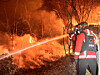 Forestry authorities carry out overnight firefighting operations on Feb. 24 to contain a wildfire that has been burning since the previous day in Geomse-ri, Samnangjin-eup, Miryang, South Gyeongsang. [KOREA FOREST SERVICE]