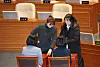 People Power Party Rep. Kim Yea-ji casts her vote on the motion to impeach President Yoon Suk Yeol on Saturday. Kim, the first visually impaired female lawmaker in Korea, left the chamber before the vote but returned with an aide to cast her vote. [YONHAP]