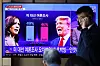 People watch a television news report on the U.S. election at Seoul Station on Tuesday morning. [REUTERS/YONHAP]