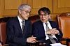 Cheon Dae-yeop, head of the Court Administration Office, left, speaks with Noh Tae-ak, chair of the National Election Commission, during the “2025 National Chief Judges’ Conference” held at the Supreme Court in Seocho District, Seoul, on Dec. 5. [KIM JONG-HO]