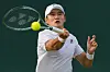Korea's Kwon Soon-woo plays a forehand return to Holger Rune of Denmark during their first-round match at Wimbledon in London on Tuesday. [AP/YONHAP]