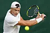 Holger Rune of Denmark plays a backhand return to Kwon Soon-woo of Korea during their first-round match at Wimbledon in London on Tuesday. [AP/YONHAP]