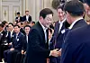 President Lee Jae Myung shakes hands with attendees during a State Affairs Planning Committee policy presentation at the Blue House on Aug. 13. [YONHAP]