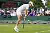 Kwon Soon-woo of Korea plays a backhand return to Holger Rune of Denmark during their first-round match at Wimbledon in London on Tuesday. [AP/YONHAP]