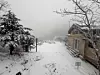Snow is seen piled up in front of a shelter in Mount Deogyu in North Jeolla on Nov. 27. [NEWS1]