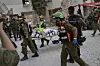 Israeli soldiers and rescue workers carry a body from a residential building destroyed by an Iranian missile strike that killed several people, in Beersheba, Israel, on Tuesday, June 24, 2025. [AP/YONHAP]