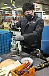 Hai, a Vietnamese worker at Korean motor company GNTECH, assembles automobile parts at a factory in Danwon District, Ansan, on March 6. [PARK SANG-MOON]