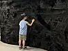 d'strict CEO Lee Sung-ho's young son strokes the wall in ″Tactile Orchestra″ (2018) by Fillip Studios during a press conference for the ″reSOUND″ exhibition at Culture Station Seoul 284 in central Seoul in June. [SHIN MIN-HEE]