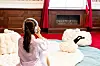 A visitor tries on headphones to listen to ASMR while sitting on cloud-like cushions as part of ″Floating Mind″ by In Yeong-hye and Miniyu [D'STRICT]