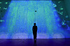 A visitor stands in front of a media art installation at the 'Mieumwanbo, Strolling Through Traditional Gardens' exhibition at the Sejong Museum of Art in central Seoul, on Feb. 24. The interactive content features a 6-meter-high waterfall that splits overhead, inspired by the Buril Falls of Mount Jiri in South Gyeongsang Province. [KOREA HERITAGE SERVICE]
