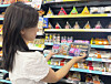 A shopper looks around at products made in collaboration with Netflix’s animated film ″KPop Demon Hunters″ at a GS25 convenience store [GS RETAIL]
