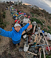 Diphda Jeju founder Byeon Su-bin raises her arms in triumph after collecting marine waste off the coast of Bukchon-ri, Jeju Island, in 2024. [BYUN SU-BIN]