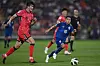 Korea's Kim Min-Jae, left, fights for the ball with Thailand midfielder Chanathip Songkrasin during a 2025 World Cup qualifier at the Rajamangala National Stadium in Bangkok, Thailand on March 26. [AFP/YONHAP]
