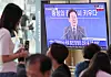 President Lee Jae Myung's town hall in Daejeon is broadcast on a screen in Seoul Station on July 4. [NEWS1]