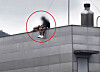 A man and a woman were spotted sitting on the edge of a high-rise rooftop in Busan, JTBC's ″Crime Chief″ reported on Aug. 11. [SCREEN CAPTURE]