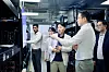 LG Group Chairman Koo Kwang-mo, right, talks to researchers at an LG Electronics factory in India on March 4. [YONHAP]
