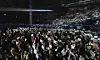 Fans of Girls’ Generation hold up paper signs reading “We missed you” during the group’s concert in Seoul in 2011. [SCREEN CAPTURE]