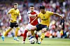 Wolverhampton Wanderers' Hwang Hee-chan, right, vies for the ball with Arsenal's Gabriel Martinelli during a 2024-25 Premier League match at the Emirates Stadium in London on Saturday. [REUTERS/YONHAP]