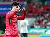 Korea captain Son Heung-min holds up a 3-0 gesture with his hands toward fans after being booed during the first half of a 2026 World Cup qualifying match against China at Seoul World Cup Stadium in western Seoul on Tuesday. [YONHAP]